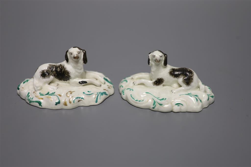 A pair of Staffordshire porcelain recumbent King Charles spaniels, c.1840, height 5cm